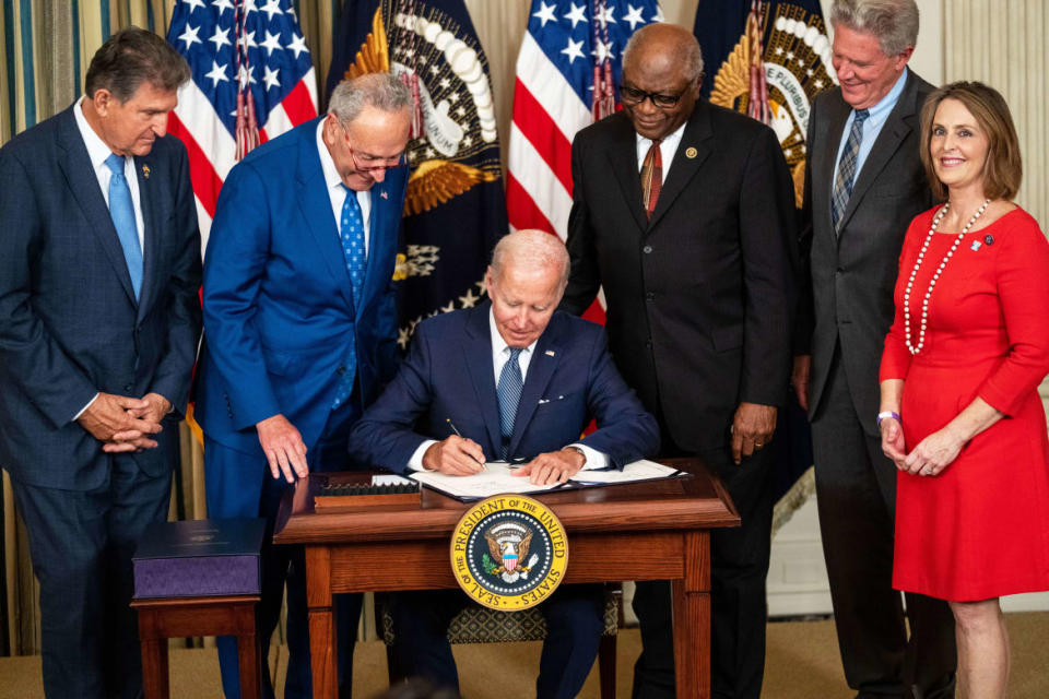 <div class="inline-image__caption"><p>President Joe Biden, center, flanked by (L to R) Sen. Joe Manchin (D-WV), Senate Majority Leader Chuck Schumer (D-NY), House Majority Whip Jim Clyburn (D-SC), Rep. Frank Pallone (D-NJ), and Rep. Kathy Castor (D-FL) delivers remarks and signs H.R. 5376, the Inflation Reduction Act of 2022 into law on Aug. 16, 2022, in Washington, D.C.</p></div> <div class="inline-image__credit">Kent Nishimura/Los Angeles Times via Getty</div>