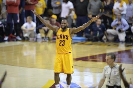 Cleveland Cavaliers forward LeBron James (23) celebrates against the Atlanta Hawks in game three of the Eastern Conference Finals of the NBA Playoffs at Quicken Loans Arena. Mandatory Credit: David Richard-USA TODAY Sports