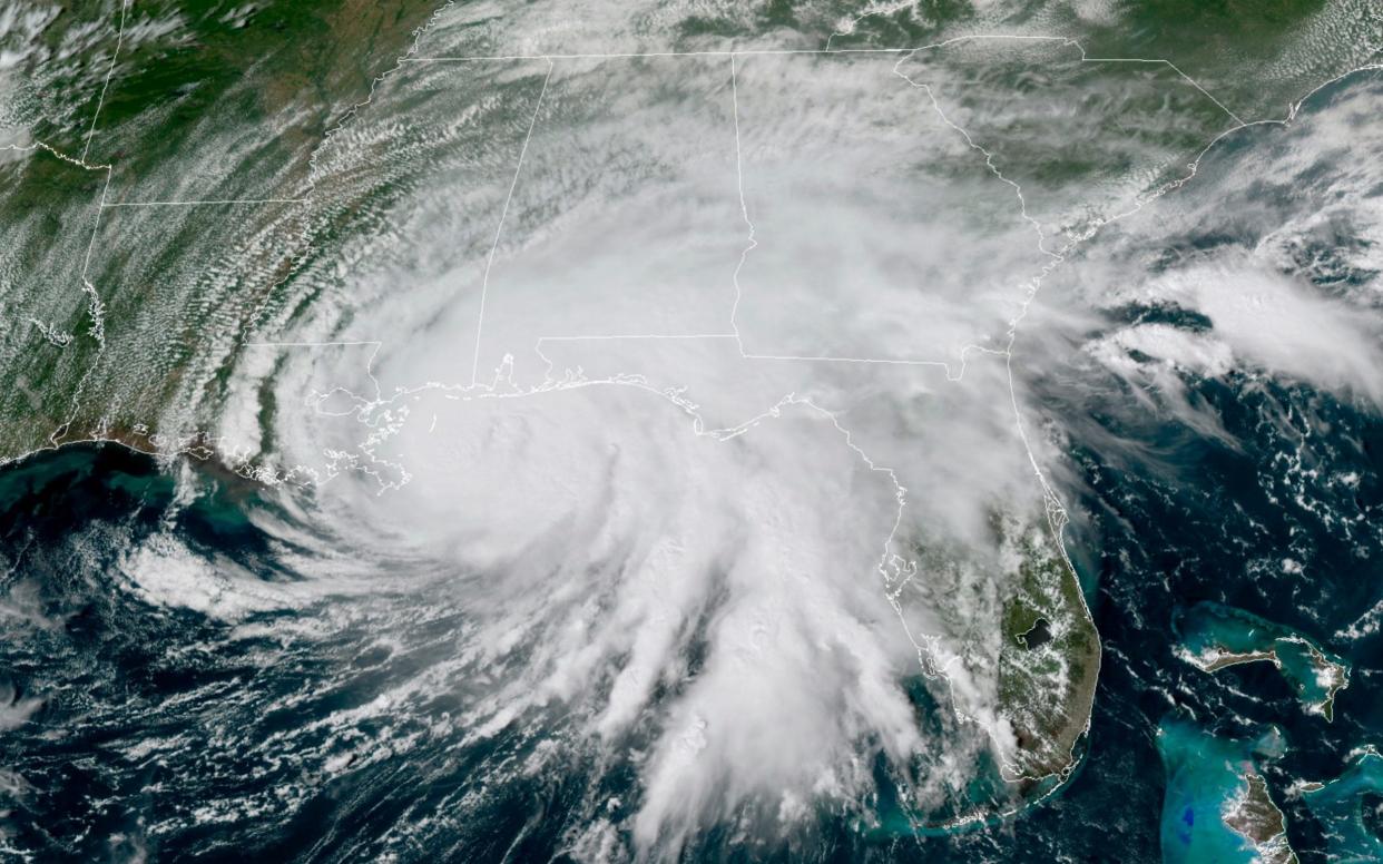 This GOES-16 GeoColor satellite image taken on Tuesday shows Hurricane Sally moving slowly towards the coast from the Gulf of Mexico - NOAA/AP