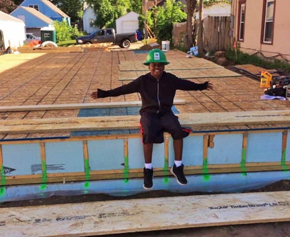 Matthias Jeffrie is photographed in front of what was to become a new home for himself and his mother, LaVera Jeffrie, built by Twin Cities Habitat for Humanity. They moved into their home in 2017.