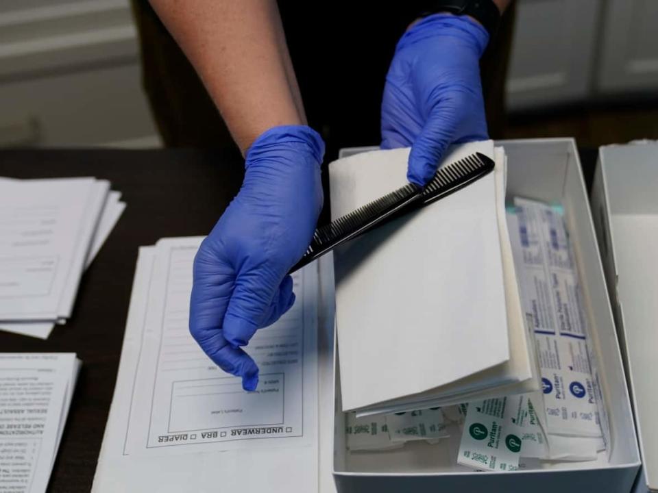 A sexual assault evidence collection kKit is unpacked in an examination room. (Eric Gay/Associated Press - image credit)