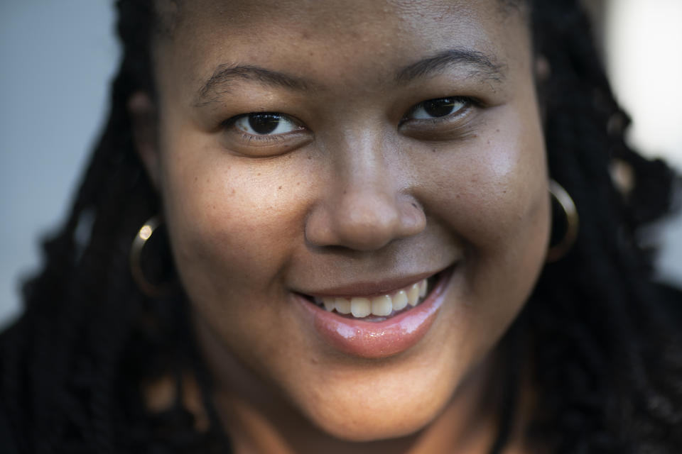 Jessica Guthrie poses for a portrait outside her home in Fredericksburg, Va., on Tuesday, Sept. 20, 2022. Through her Instagram, Jessica regularly hears from other Black caregivers, mostly women, who have eerily similar stories of not being heard, feeling isolated or being denied proper treatment. (AP Photo/Wong Maye-E)