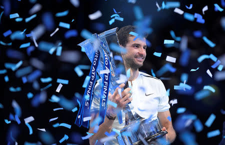 Tennis - ATP World Tour Finals - The O2 Arena, London, Britain - November 19, 2017 Bulgaria's Grigor Dimitrov celebrates with the trophy after winning the final against Belgium's David Goffin REUTERS/Toby Melville