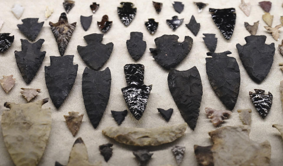 A collection of arrowheads are shown as part of the exhibition "The Greatness of Mexico" displaying for the first time in the country more than 800 pieces repatriated from abroad in the last three years and others that were in safekeeping and confiscation warehouses, at the Anthropology Museum in Mexico City, Friday, Oct. 1, 2021. (AP Photo/Marco Ugarte)