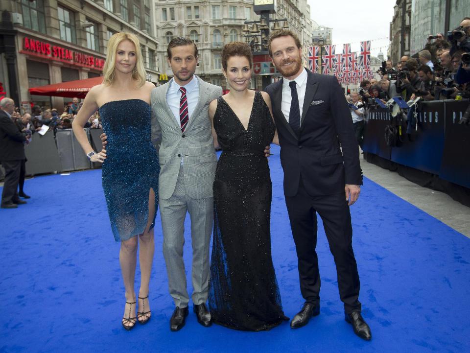 From left, actors Charlize Theron, Logan Marshall-Green, Noomi Rapace and Michael Fassbender arrive at a central London cinema for the World Premiere of Prometheus, Thursday, May 31, 2012. (AP Photo/Joel Ryan)