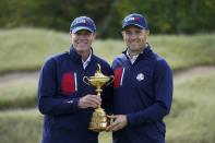 Team USA captain Steve Stricker and Team USA's Jordan Spieth pose for a picture during a practice day at the Ryder Cup at the Whistling Straits Golf Course Wednesday, Sept. 22, 2021, in Sheboygan, Wis. (AP Photo/Charlie Neibergall)