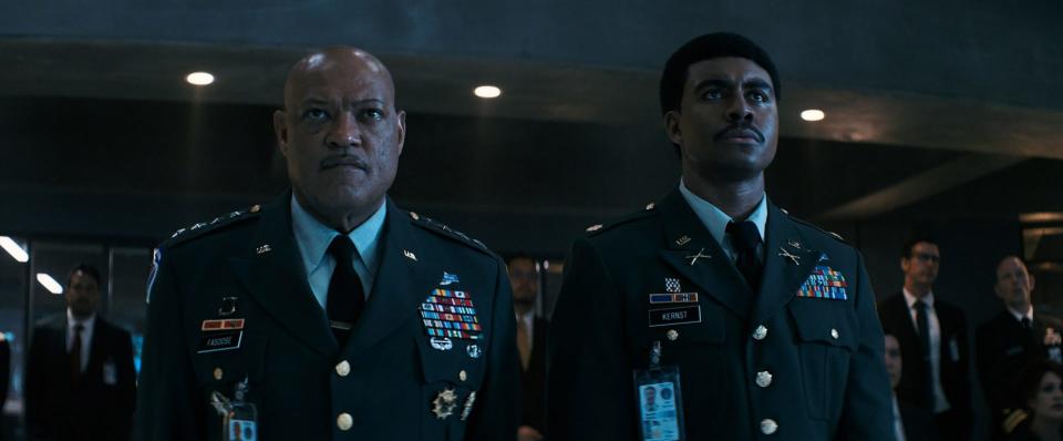 Laurence Fishburne stands with another military officer on Peacock's MaGruber