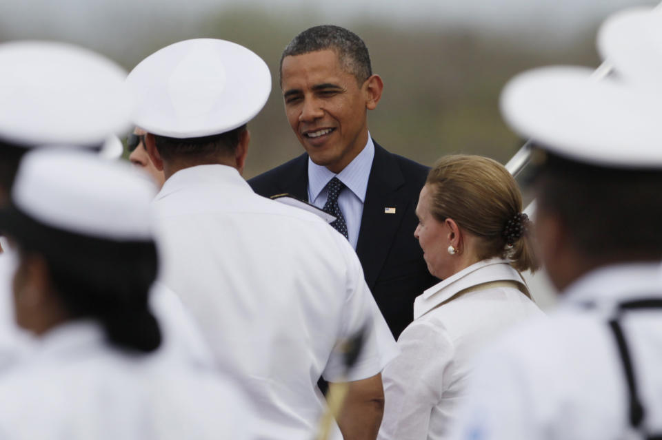 President Barack Obama is greeted at the airport as he arrives to Cartagena, Colombia, Friday April 13, 2012. Obama is in Cartagena to attend the sixth Summit of the Americas.  (AP Photo/Carolyn Kaster)