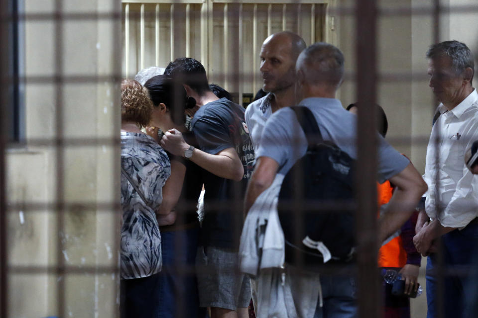 Family members of missing British girl Nora Anne Quoirin arrive at a hospital morgue in Seremban, Negeri Sembilan, Malaysia, Tuesday, Aug. 13, 2019. Malaysian police say the family of a missing 15-year-old London girl has positively identified a body found near the nature resort where she disappeared over a week ago. (AP Photo/Lai Seng Sin)