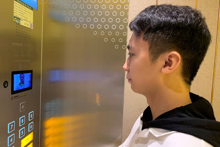A staff member has his face scanned at an elevator during a demonstration to the media at Alibaba Group's futuristic FlyZoo hotel in Hangzhou, Zhejiang province, China January 22, 2019. REUTERS/Xihao Jiang