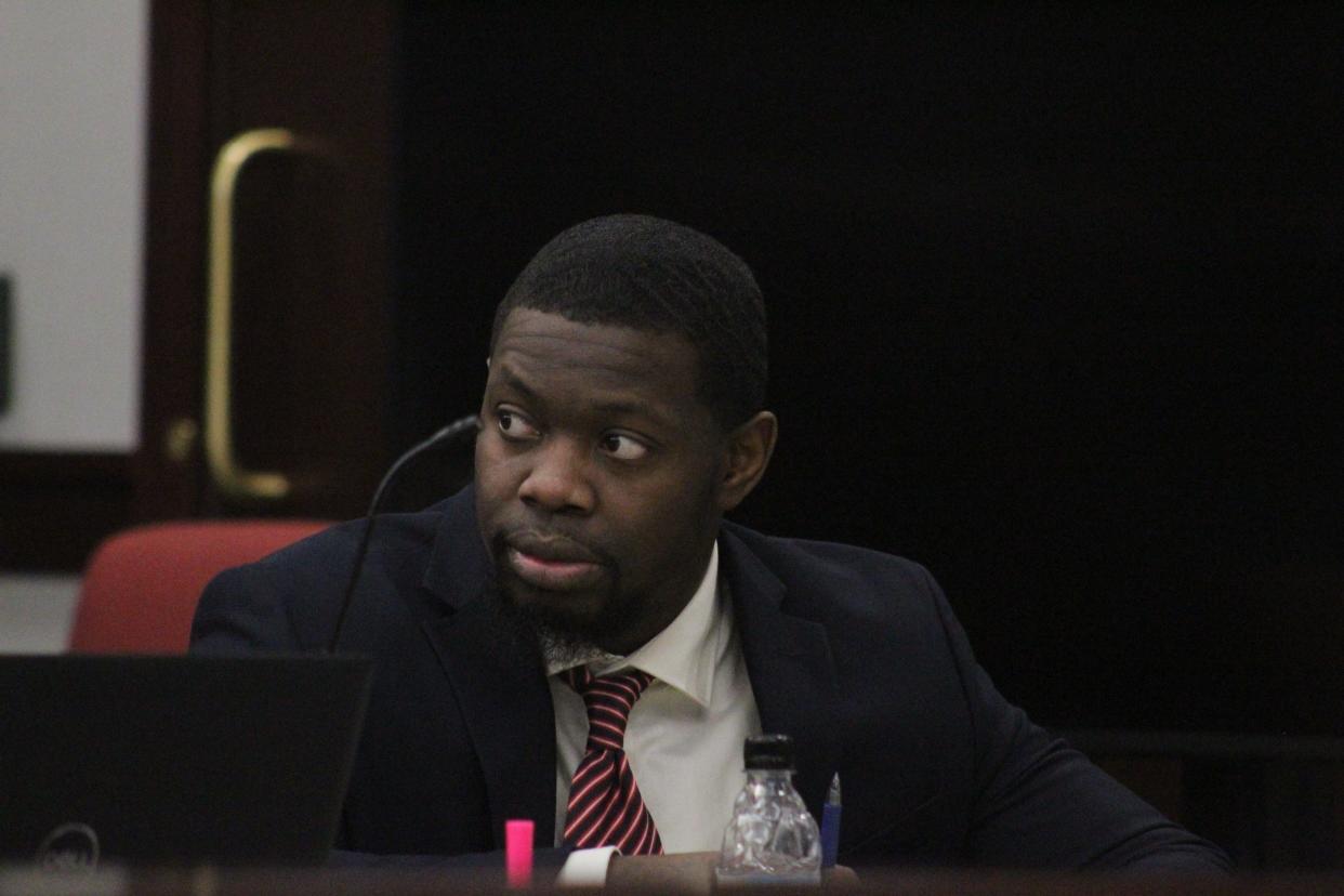 Othal Wallace sits at the defense table in the Clay County Courthouse on Friday during jury selection. Wallace is charged with first-degree murder in the killing of Daytona Beach Police Officer Jason Raynor.