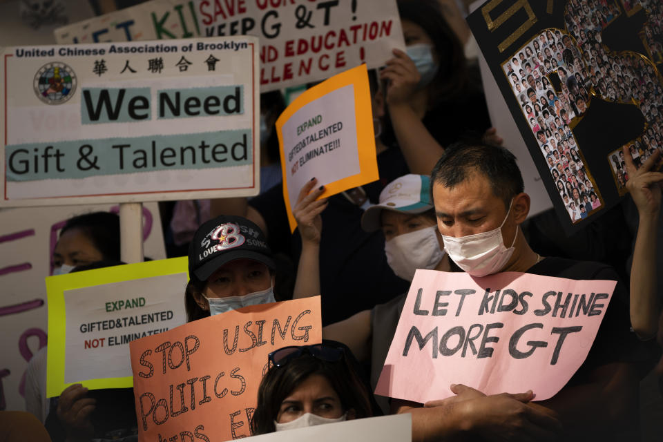 FILE - In this Thursday Oct. 14, 2021, file photo, protesters at City Hall condemn Mayor Bill de Blasio's plan to phase out the Gifted and Talented (G&T) public school program in New York. Public school programs for the gifted and talented are garnering increased scrutiny nationwide, as critics denounce them as modern-day segregation and push for broader access or outright elimination. (AP Photo/John Minchillo, File)