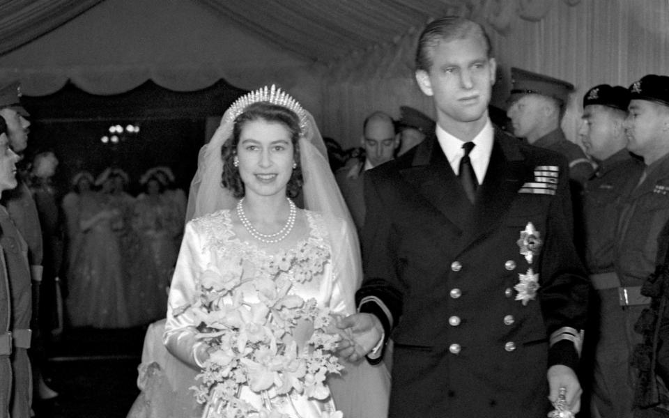 Queen Elizabeth II and the Duke of Edinburgh leaving Westminster Abbey after their wedding ceremony on November 20, 1947 - PA