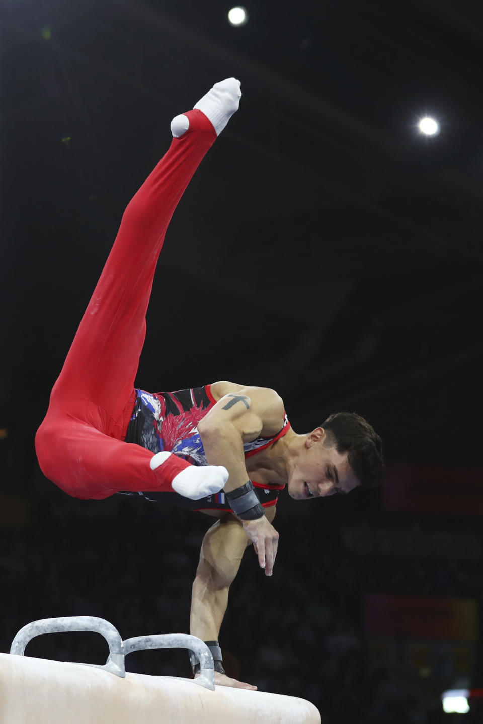 Artur Dalaloyan of Russia performs on the pommel horse in the men's all-around final at the Gymnastics World Championships in Stuttgart, Germany, Friday, Oct. 11, 2019. (AP Photo/Matthias Schrader)