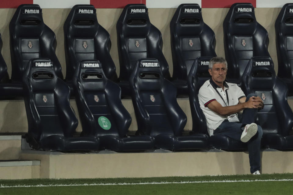 Barcelona's head coach Quique Setien sits on the bench during the Spanish La Liga soccer match between FC Barcelona and Villareal at La Ceramica stadium in Villareal, Spain, Sunday, July 5, 2020. (AP Photo/Jose Miguel Fernandez de Velasco)