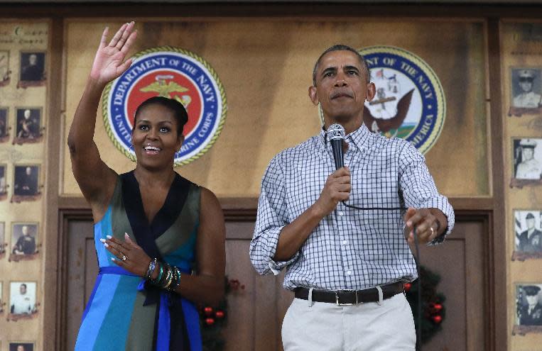 President Barack Obama and first lady Michelle Obama, arrive for an event to thank service members and their families at Marine Corps Base Hawaii, in Kaneohe Bay, Hawaii, Sunday, Dec. 25, 2016. (AP Photo/Carolyn Kaster)