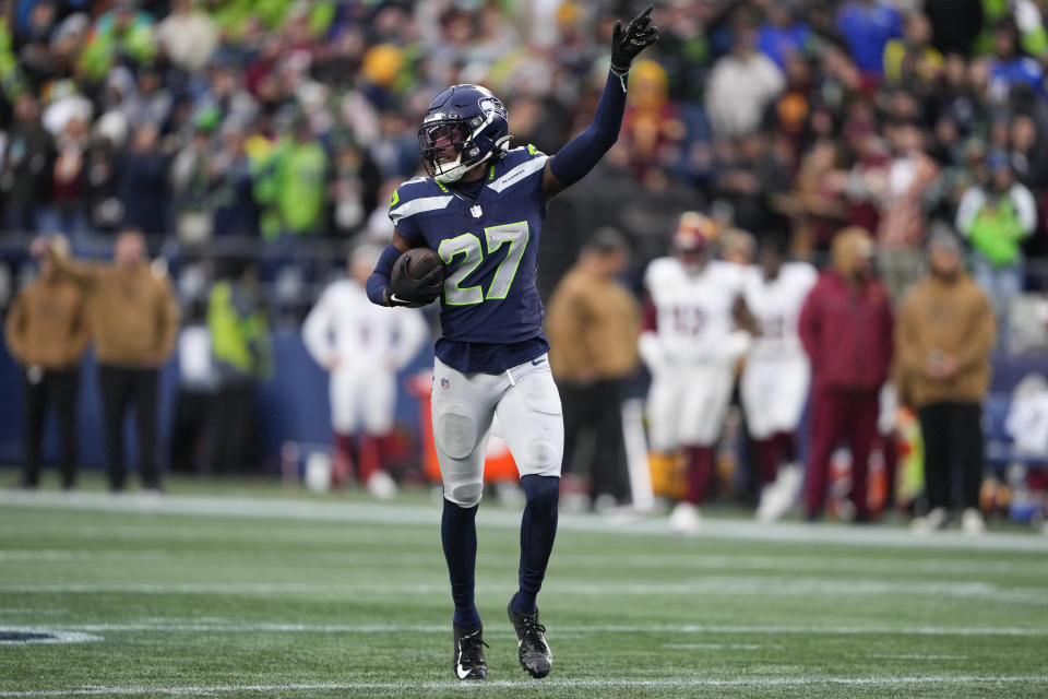 Seattle Seahawks cornerback Riq Woolen (27) celebrates after a fumble recovery in the second half of an NFL football game against the Washington Commanders in Seattle, Sunday, Nov. 12, 2023. (AP Photo/Lindsey Wasson)