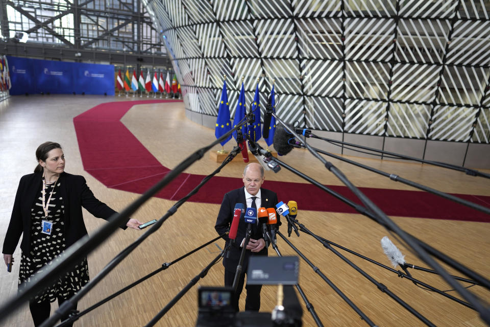 Germany's Chancellor Olaf Scholz speaks with the media as he arrives for an EU summit at the European Council building in Brussels Brussels on Thursday, Feb. 9, 2023. European Union leaders are meeting for an EU summit to discuss Ukraine and migration. (AP Photo/Virginia Mayo)