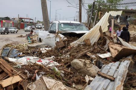 A truck sits among debris in the aftermath of Tropical Storm Lidia in Los Cabos, Mexico, September 1, 2017. REUTERS/Fernando Castillo