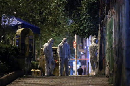 Forensics experts work at the scene after a bomb blast, in central Athens, Greece, April 19, 2017. REUTERS/Alkis Konstantinidis