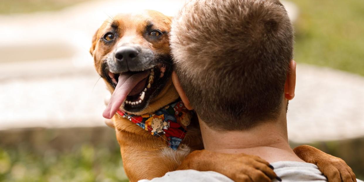 man holding dog