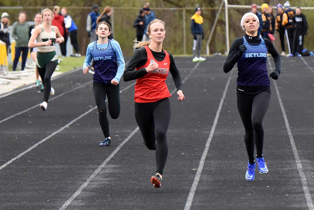Pinckney's CeCe Thorington (second from left) won the 400-meter run during the Highlander Games track and field meet Saturday, April 20, 2024 at Howell High School.