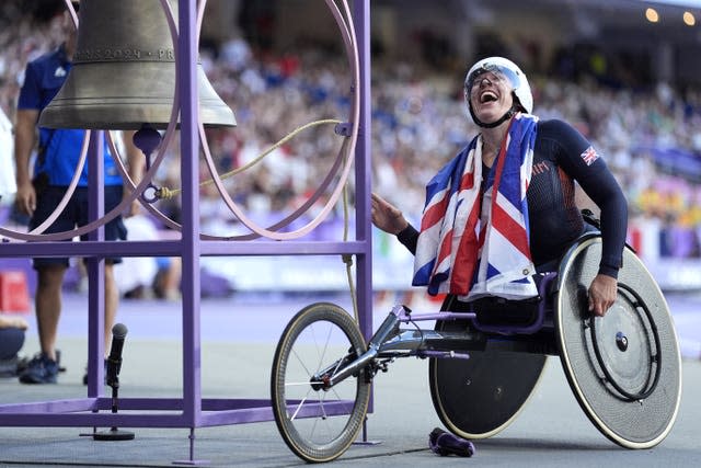 Great Britain’s Hannah Cockroft rings the bell after winning gold