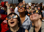 <p>People watch the solar eclipse from the observation deck of The Empire State Building in New York City, Aug. 21, 2017. (Photo: Brendan McDermid/Reuters) </p>