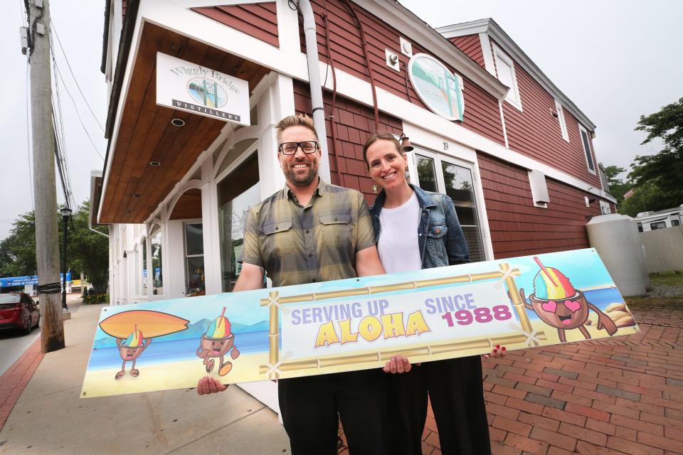 Trevor Fitzgerald and his wife Rachel stand outside the new home of Hawaiian Jim's Shave Ice as they celebrate the shop's  35th season at York Beach.