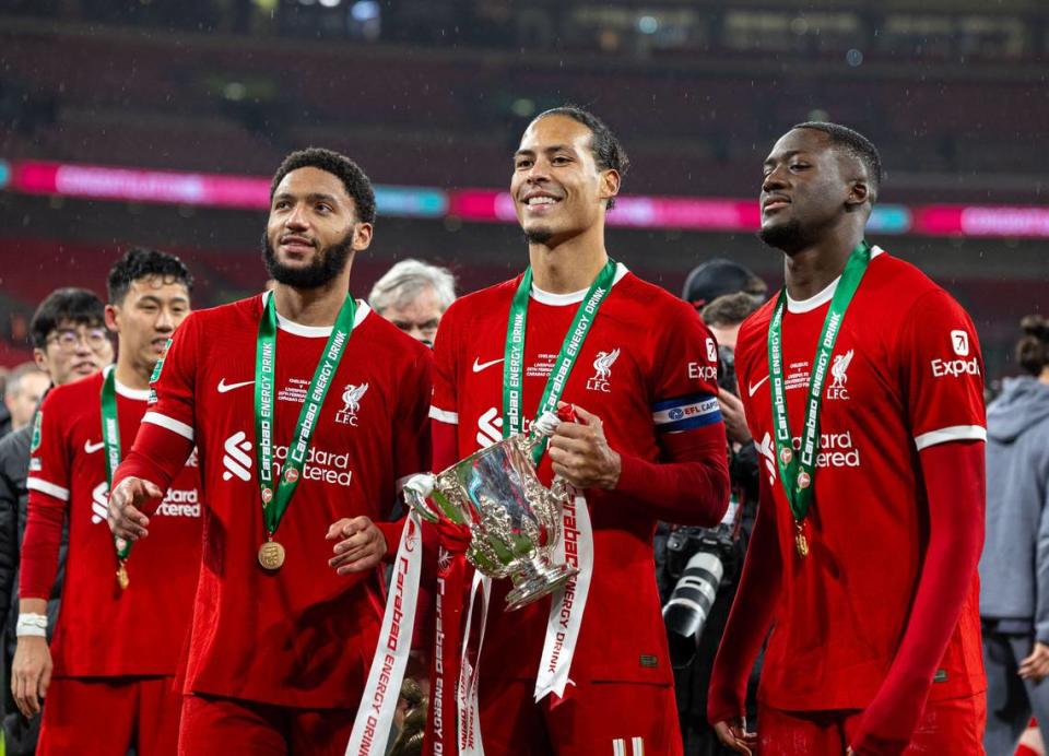 Liverpool’s Joe Gomez (Front, L), captain Virgil Van Dijk (Front, C) and Ibrahima Konate (Front, R) celebrate with the trophy after the English Football League Cup final match between Chelsea and Liverpool in London, Britain, on Feb. 25, 2024. Xinhua/Xinhua/Sipa USA