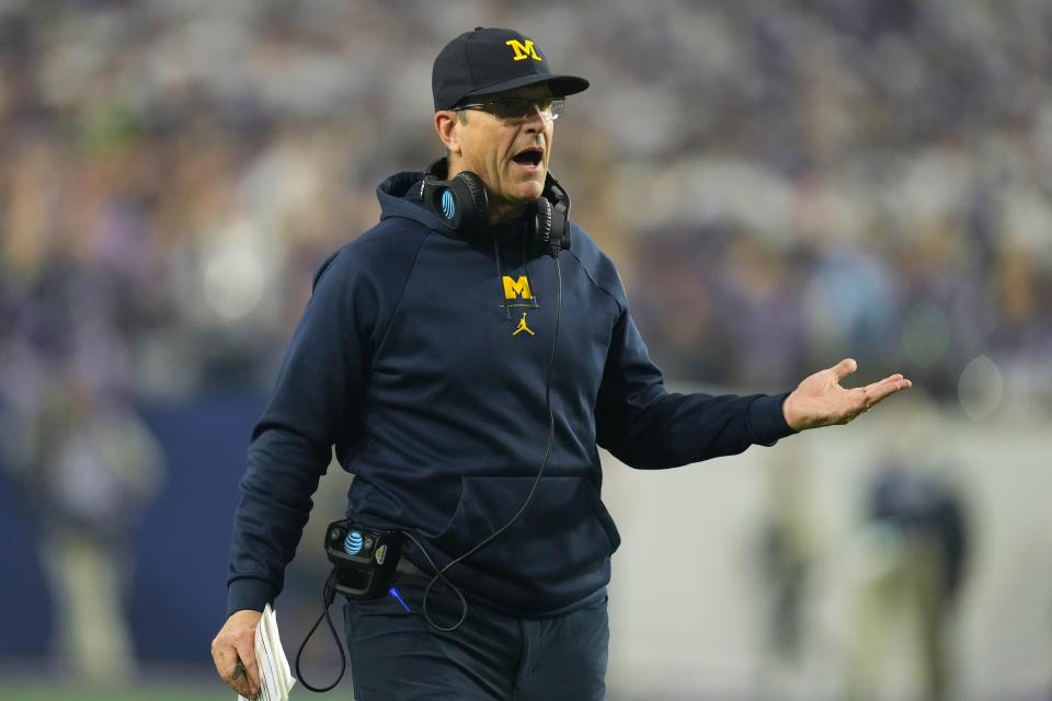 Michigan head coach Jim Harbaugh gestures from the sidelines during the 2022 Fiesta Bowl against TCU.