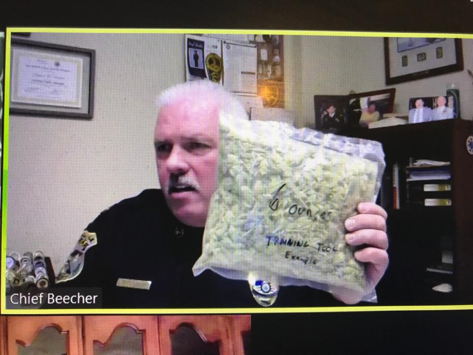Mount Olive Police Chief Stephen Beecher holds a bag filled with tea as a visual aid to demonstrate the approximate volume of 6 ounces of marijuana, now legal to possess in that amount in New Jersey, during a webinar about potential retail marijuana sales in Mount Olive. April 22, 2021.