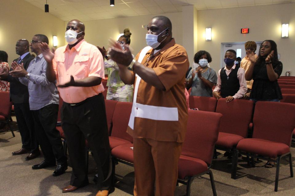 Parishioners at First Missionary Baptist Church praise the Lord during the National Children's Day service held on Sunday at the church.