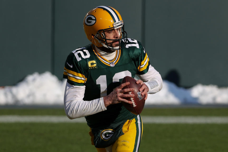 GREEN BAY, WISCONSIN - JANUARY 24: Aaron Rodgers #12 of the Green Bay Packers drops back to pass in the first quarter against the Tampa Bay Buccaneers during the NFC Championship game at Lambeau Field on January 24, 2021 in Green Bay, Wisconsin. (Photo by Dylan Buell/Getty Images)