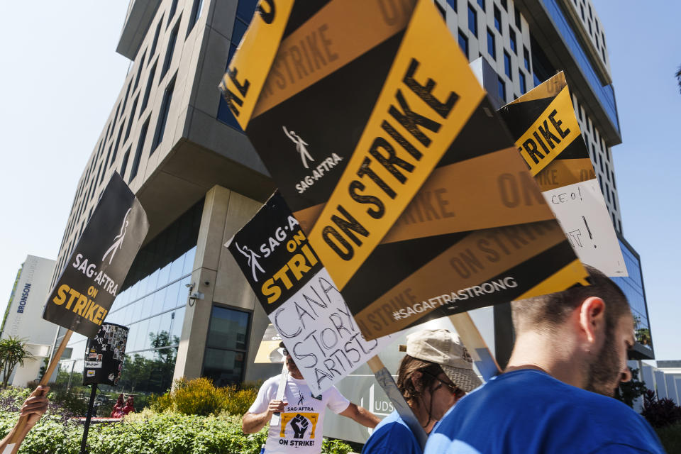 SAG-AFTRA actors walk on a picket line outside Netflix studios on Tuesday, Sep. 26, 2023, in Los Angeles. (AP Photo/Damian Dovarganes)