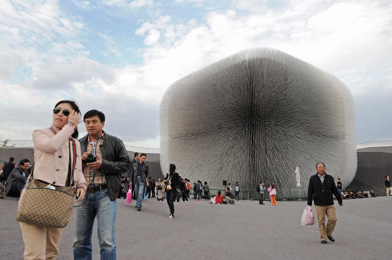 Visitors outside the UK pavilion designed by Thomas Heatherwick at World Expo 2010 in Shanghai on October 29, 2010