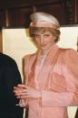 <p>Diana wore a peach blazer with a perfectly coordinated hat and bag during a visit to Tokyo parliament in May 1986. It was simply monochromatic styling at its finest.<br></p>