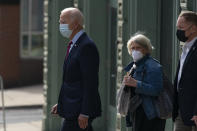 Democratic presidential candidate former Vice President Joe Biden and Anita Dunn center, depart The Queen theatre in Wilmington, Del., Monday, Oct. 19, 2020. (AP Photo/Carolyn Kaster)