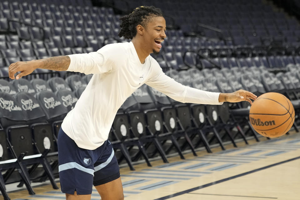 Memphis Grizzlies guard Ja Morant chases the ball during the NBA basketball team's practice Friday, Dec. 15, 2023, in Memphis, Tenn. (AP Photo/George Walker IV)