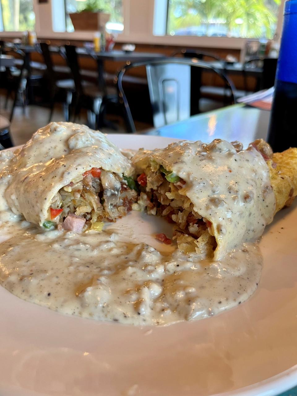 Motor City Coney Island's MCC omelet is made with four eggs, bacon, ham, sausage, sautéed onions, peppers, mushrooms and shredded cheese. Sausage gravy comes on top or on the side.