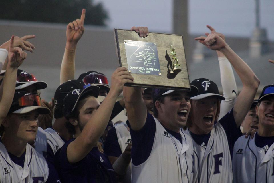 Fletcher players celebrate with the Gateway Conference baseball trophy after defeating Sandalwood on April 22, 2022. [Clayton Freeman/Florida Times-Union]