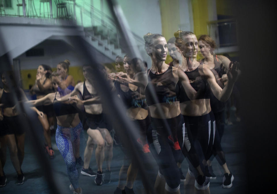 Natacha Kovalenko of Russia trains at the Paraiso de Tuiuti samba school in Rio de Janeiro, Brazil, Jan. 15, 2020. Kovalenko is part of the movement of foreigners who come to Brazil to train in the ways of hip swiveling and hot stepping, spending months at the samba schools that during Rio's world-famous Carnival will dance for more than an hour through Rio's 700-meter (2,300-foot) Sambadrome. After the parade, the outsiders return to their home countries and spread their samba fever. (AP Photo/Silvia Izquierdo)