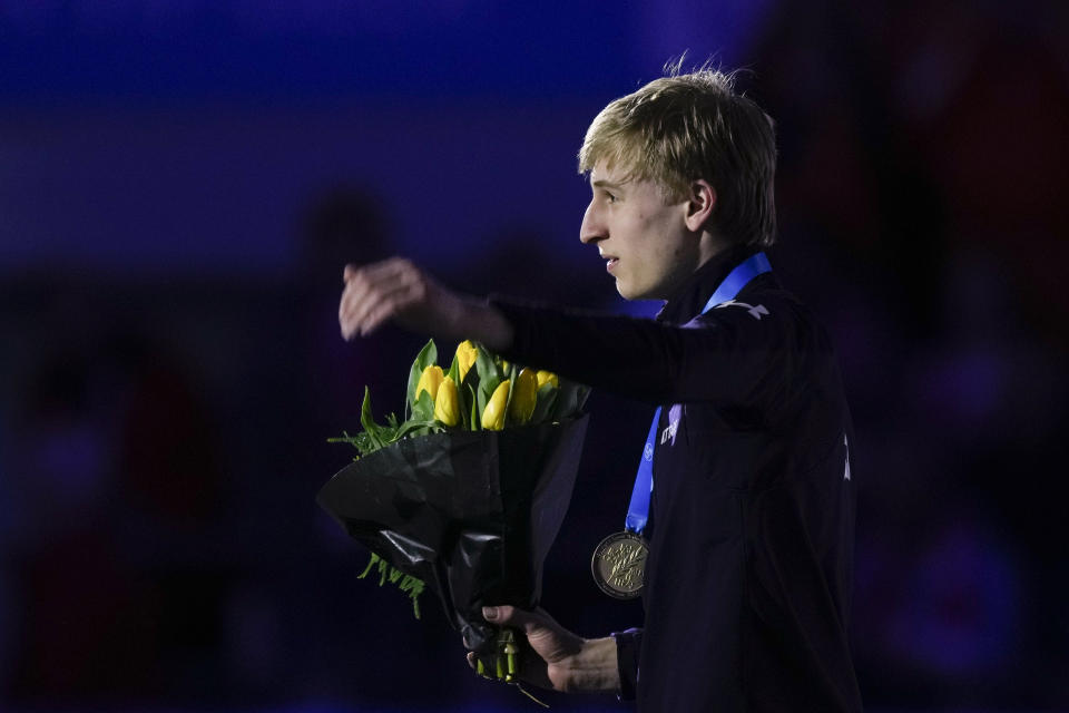 Jordan Stolz of the U.S. celebrates winning his third gold medal on the podium of the 1500m Men event of the Speedskating Single Distance World Championships at Thialf ice arena Heerenveen, Netherlands, Sunday, March 5, 2023. (AP Photo/Peter Dejong)