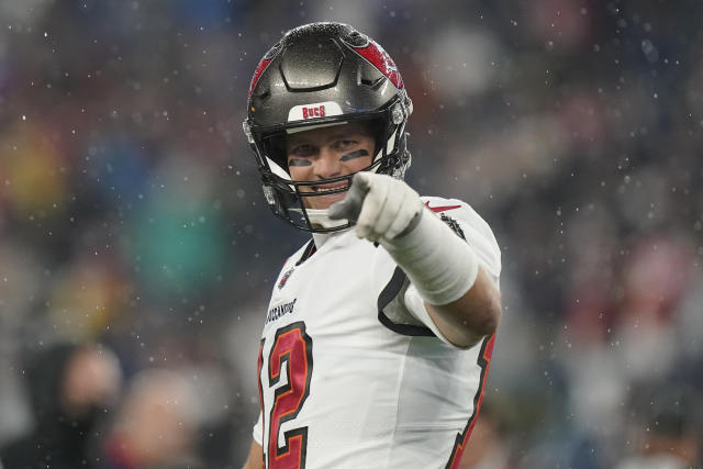 Tampa Bay Buccaneers quarterback Tom Brady (12) puts on his helmet during  the second half of an NFL football game against the New England Patriots,  Sunday, Oct. 3, 2021, in Foxborough, Mass. (