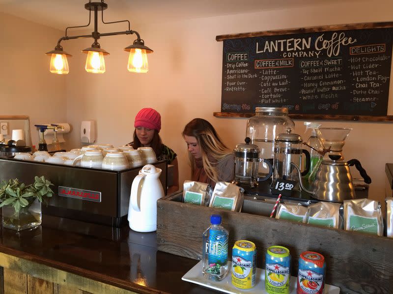FILE PHOTO: Baristas prepare for Friday's grand opening at the Lantern Coffee Company in Williston, North Dakota