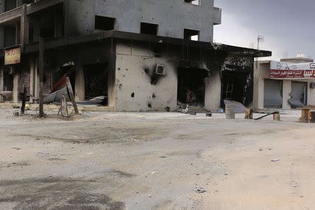 A damaged building is pictured after clashes between rival militias, in an area at Alswani road in Tripoli July 28, 2014. REUTERS/Hani Amara