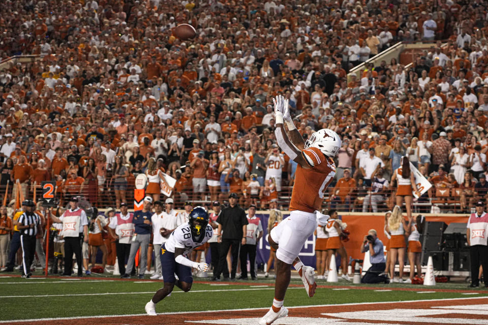 Oct. 1, 2022; Austin; Texas Longhorns tight end Ja’Tavion Sanders (0) jumps for a catch in the endzone for a touchdown against the West Virginia Mountaineers during a game at Royal Memorial Stadium. Aaron E. Martinez/American-Statesman via USA TODAY NETWORK