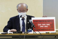 Lawyer Kenji Utsunomiya, a representative of an anti-Olympics group, shows an anti-Olympic banner during a press conference after submitting a petition to the Tokyo government calling for the cancellation of the Tokyo 2020 Olympics and Paralympics. An online petition calling for the Tokyo Olympics to be cancelled has been submitted to the Tokyo government with over 350,000 signatures on Friday morning. The rollout of the petition comes with Tokyo, Osaka and several other areas under a state of emergency with coronavirus infections rising - particularly new variants. (AP Photo/Eugene Hoshiko)