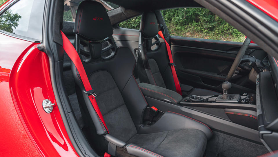 The GTS Interior Package, seen here in Carmine Red, adds colored contrast stitching throughout the cabin. - Credit: Photo: Courtesy of Porsche AG.