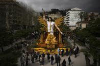 A sculpture of Nike the Greek god of victory made with lemons is displayed during the 90th edition of the Lemon Festival in Menton, France, Friday, March 1, 2024. (AP Photo/Daniel Cole)